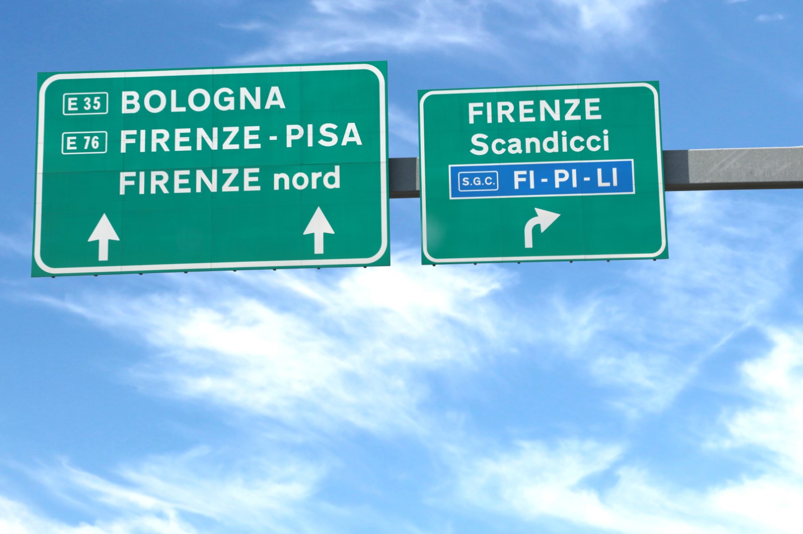road signs of the Italian highway with the localities of Florence Bologna Pisa and blue sky in the background