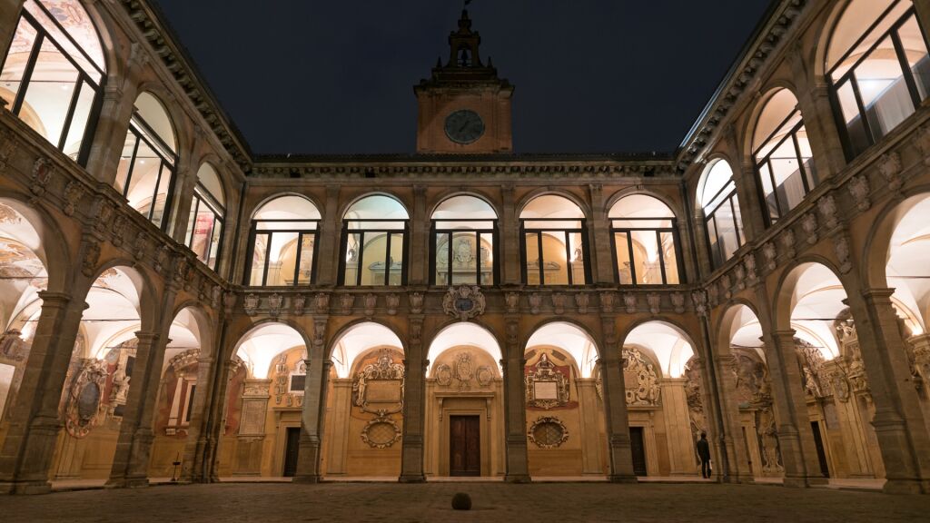 The Archiginnasio atrium at night. It houses now the Municipal Library and the famous Anatomical Theatre. Bologna, Italy.