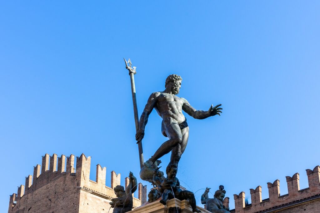 Bologna, Italy - December 1, 2021: The Fountain of Neptune located in the eponymous square, Piazza del Nettuno, next to Piazza Maggiore.