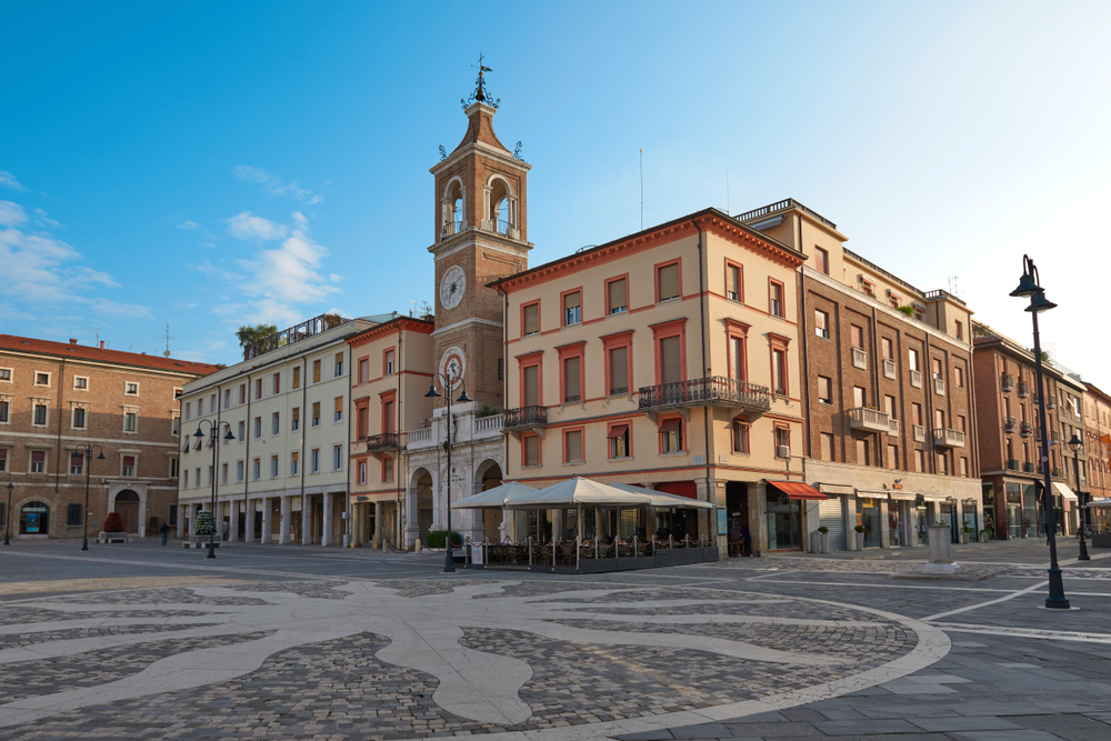 Rimini, Italy - May 24, 2018. Central square of Rimini. Square of the Three Martyrs in Rimini with the ancient clock tower.