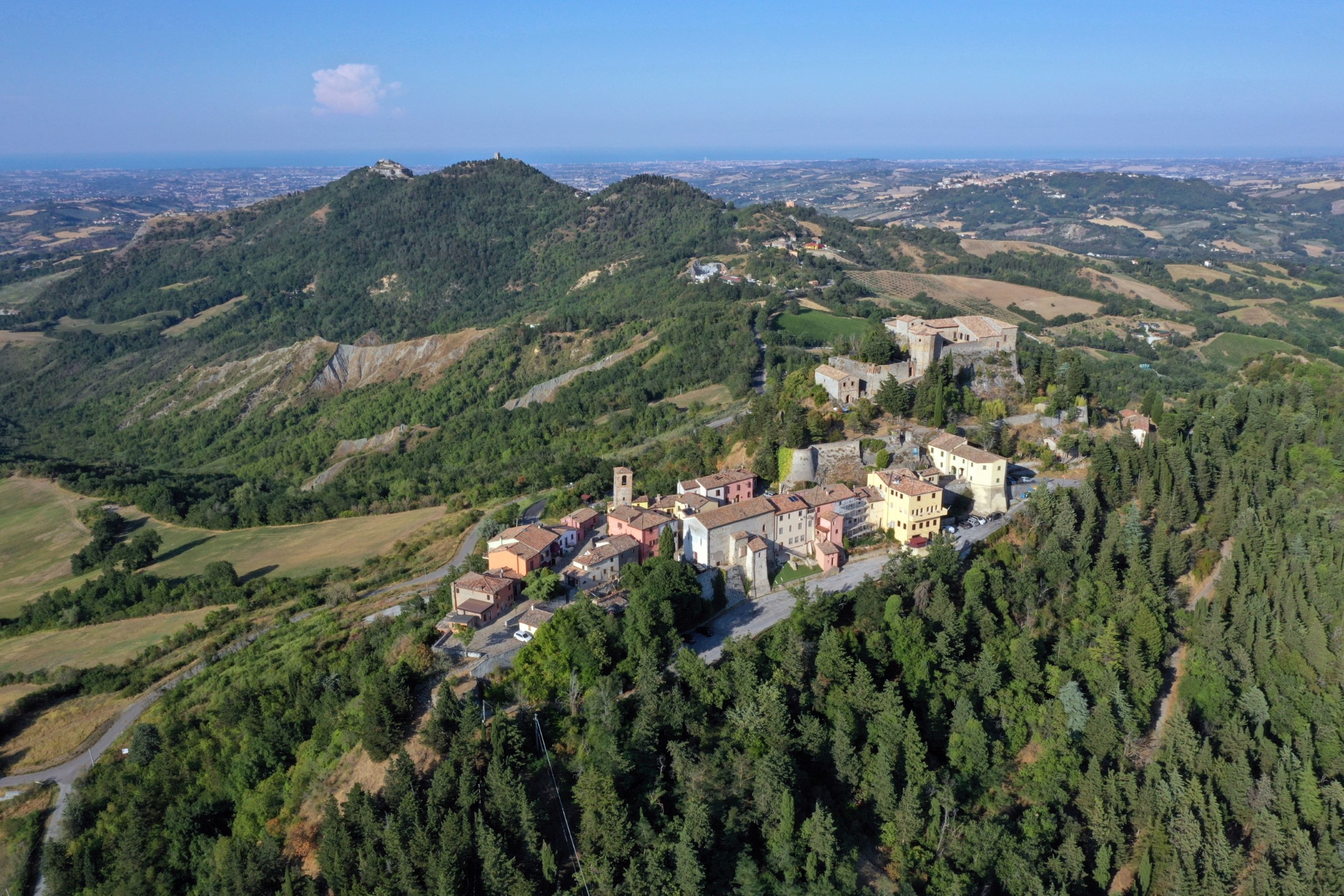 Castello Montebello, aerial view of Montebello village and castle also named Azzurrina castle. Poggio Torriana, Emilia Romagna, Italy